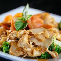 Pad Kee Mow (Drunken Noodles) · Sautéed wide flat noodles with broccoli, carrots, tomatoes, eggs & fresh basil with spicy br...