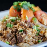 Bangkok Fried Rice · Combination (chicken & beef) Thai style fried rice with eggs & onions.