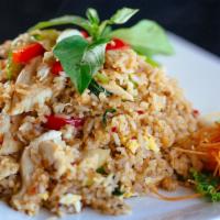 Spicy Fried Rice · House special fried rice with bell peppers, yellow onions & fresh basil leaves.