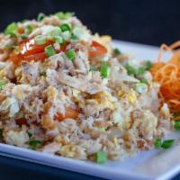 Crabmeat Fried Rice · Thai style fried rice with tomatoes, eggs & onions, topped with sautéed tasty crabmeat.