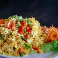 Pineapple Fried Rice (No Meat) · Fried rice with yellow curry powder, pineapples, raisins, bell peppers, carrots, sweet peas,...