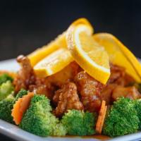 Orange Chicken · Fried chicken with orange sauce served with steamed broccoli.