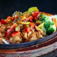 Volcano Chicken · Breaded deep fried chicken topped with house special chili sauce & served with grilled, butt...
