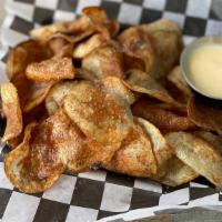 Home-Style Chips · Fried fresh Idaho potatoes.  Served with our house cheese sauce.