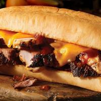 Westerner Sandwich · Texas sized sandwich, with your choice of two slow-smoked meats and cheddar cheese on a toas...