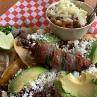 Tacos Matamoros · Four sirloin tacos with sliced avocado and queso fresco, served on corn tortilla, includes a...