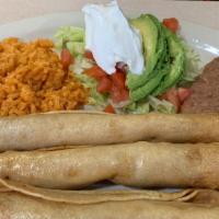 Flautas Plate · 3 chicken flautas, served with rice, refried beans, salad, guacamole and sour cream.  No tor...