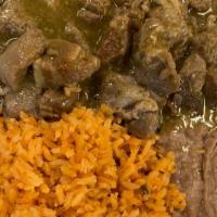 Puerco En Salsa (Green Or Red) · Pork meat cooked with either green or red sauce, served with refried beans, rice and two tor...