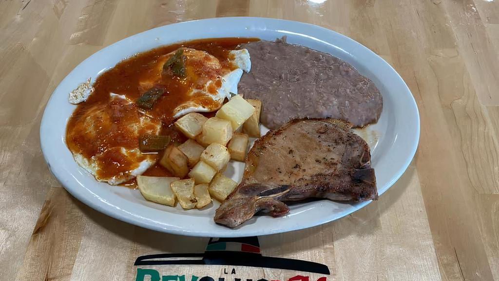 Pork Chop & Eggs Plate · One pork chop, two eggs with ranchero sauce on top, served with refried beans, potatoes and two tortillas.