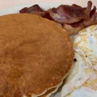 Pancakes Plate · Two pancakes, two eggs and two strips of bacon.