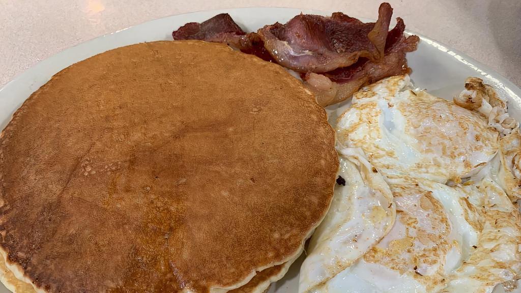 Pancakes Plate · Two pancakes, two eggs and two strips of bacon.