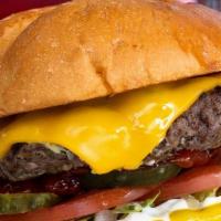 Junior 1/4 Lb Cheeseburger · Shredded Lettuce, Tomatoes, Crinkle Dill Pickles, Diced Onions, American Cheese.
