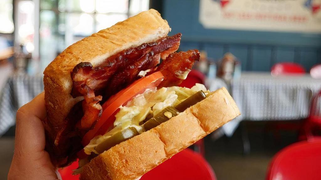 Blt · Slices of center-cut bacon, lettuce, tomato, and mayo on buttered Texas Toast