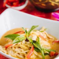 Red Curry / Gang Ped · Traditional style red curry in coconut milk with bamboo shoots, basil leaves, and bell peppe...