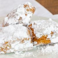 Beignet · A light square doughnut usually sprinkled with powdered sugar.