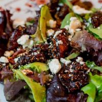 Marinated Fig Salad · Marinated figs, golden raisins, dried
cranberries, crumbled goat cheese
and toasted pecans o...