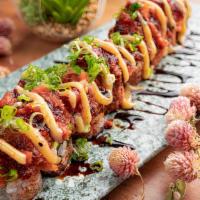 Poke Poke · Shrimp tempura, avocado, cucumber topped off with diced spicy tuna and yellowtail with unagi...