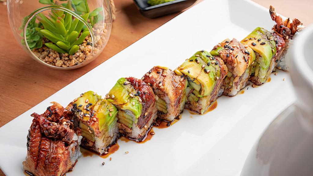 Sky Diver · Soft shell crab inside topped with avocado, sesame seeds, eel and eel sauce.