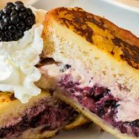 Stuffed French Toast · filled with cream cheese and berries .