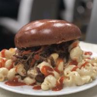 Mac Lovin Burger · Beef burger topped with beef bacon, mac n cheese, beef brisket and a drizzle of turban sauce...