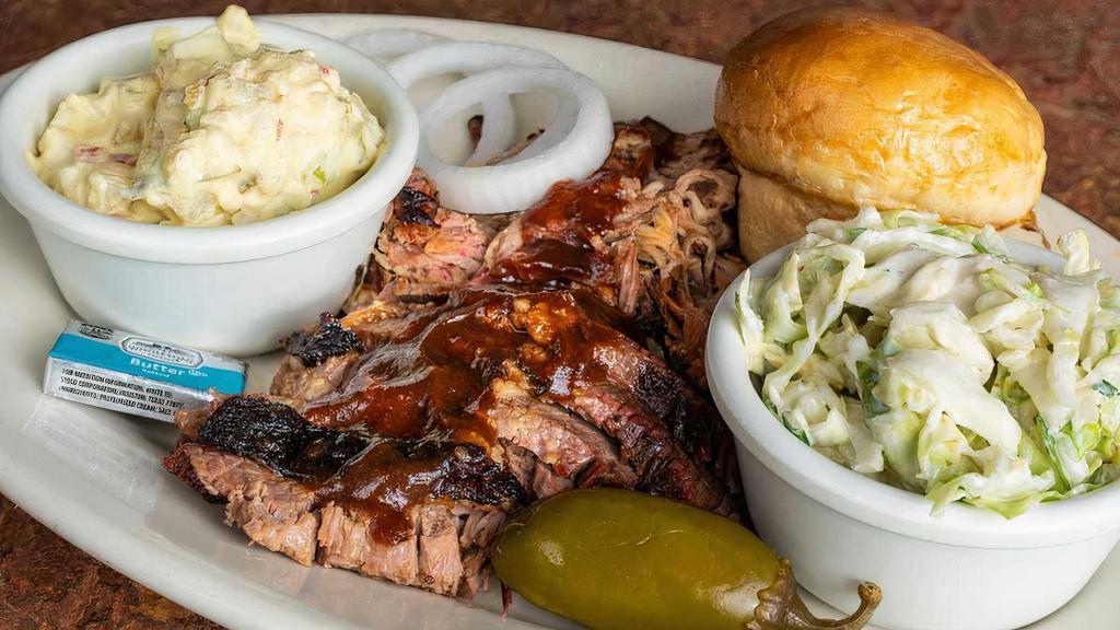 2 Meat · Meats Rubbed, mopped and slow pit-smoked. Served with your choice of two made from scratch sides, onions, a jalapeno, one roll and BBQ sauce.