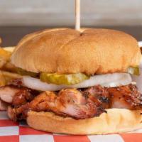 Backyard Chicken Sandwich · Served on a toasted bun with onions, pickles and BBQ sauce.  Choose two made from scratch si...