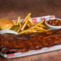 Baby Back Ribs · Slow smoked pork ribs mopped with our Daddy's BBQ Sauce - Fall off the bone!