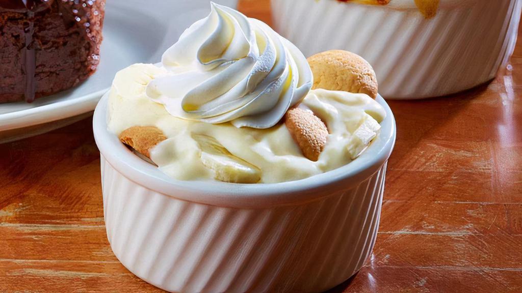 Banana Pudding · It's cool, rich & creamy.  Vanilla pudding, sliced bananas & vanilla wafers - topped with real whipping cream.