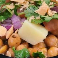 Chole Chaat · Seasoned chick peas, topped with diced onions, tomatoes, cilantro, green chilies, potatoes a...