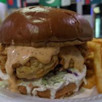 Zinger Burger · Crispy deep fried chicken breast, topped with delicious coleslaw, special zinger sauce, serv...