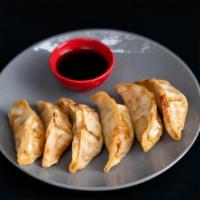 Fried Potstickers (6 Piece) · Six fried pork dumplings filled with meat, vegetables, and spices. Served with house made gy...