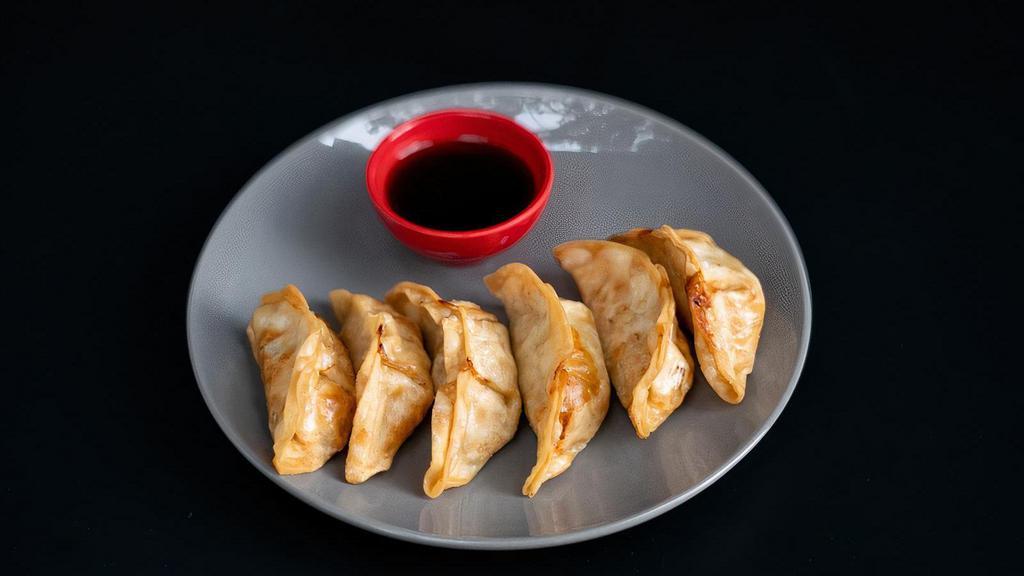 Fried Potstickers (6 Piece) · Six fried pork dumplings filled with meat, vegetables, and spices. Served with house made gyoza sauce.