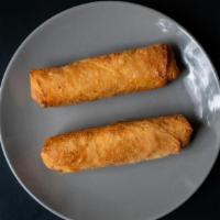 Spring Roll (2 Piece) · Two large fried vegetarian Spring Rolls in a crispy wrapper. Served with house made Thai Pea...