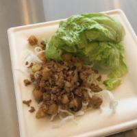 Lettuce Wraps · Marinated Chicken with Water Chestnuts and Shiitake Mushrooms, served over crispy rice stick...