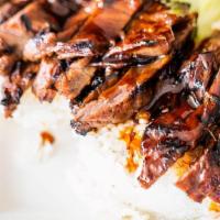 Teriyaki Beef Plate · Over a half pound of marinated steak, grilled to perfection. Covered in fresh teriyaki sauce...