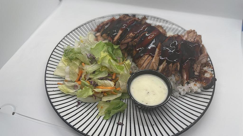 Teriyaki Chicken Breast Plate · Over a half pound of marinated chicken breast, grilled to perfection. Covered in fresh teriyaki sauce and served over a bed of rice with a simple side salad.