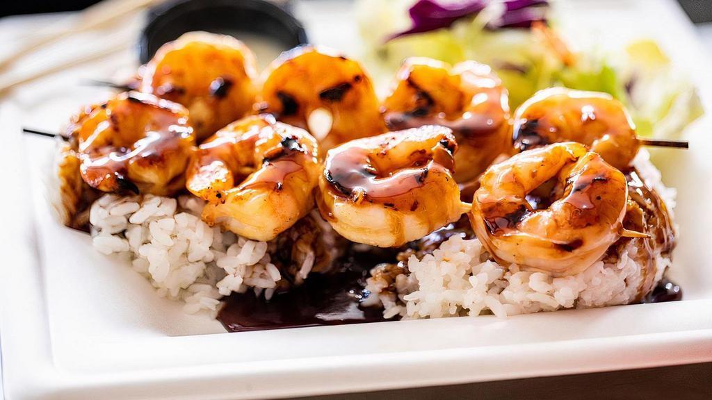 Teriyaki Shrimp Plate · A dish with 12 marinated shrimp, grilled to perfection. Covered in fresh teriyaki sauce and served over a bed of rice with a simple side salad.