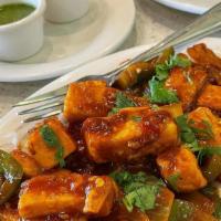 Paneer Chili  · Cubes of Indian cottage cheese sautéed with onion, bell pepper, chili sauce and light soy sa...