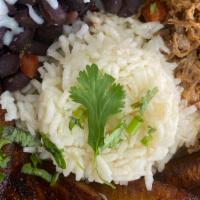 Pabellon Bowl  · Made with shredded beef, white rice, black beans and sweet plantain.
