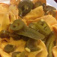 Nachos Grandes · nachos grandes (chips with cheese)
includes jalapenos