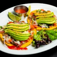 Ceviche Cancun · 2 ceviche tostadas with lime juice cured tilapia, mixed with pico de gallo, topped with avoc...