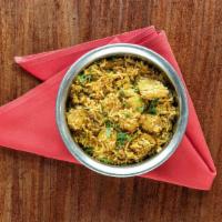Chicken Biryani · Fragrant Basmati rice sautéed with fresh garlic, ginger, cumin, onions & turmeric; Served wi...