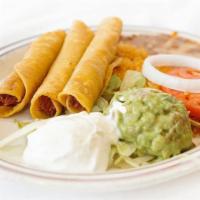 Flauta Dinner · Three crispy, chicken flautas, served with rice, beans, guacamole and sour cream.