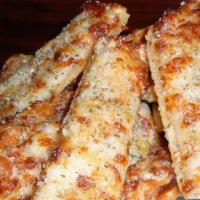 Garlic Cheese Bread · Fresh bread sticks brushed with butter and topped with minced garlic, mozzarella and Parmesa...