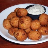 Hushpuppies (20 Pc.) · Served with a side of tartar sauce.