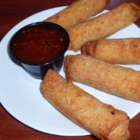 Egg Rolls (5) · Five pork egg rolls served with a side of egg roll dipping sauce.