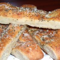 Paradise Sticks · Fresh bread sticks brushed with olive oil, garlic and a hint of Parmesan cheese. Served with...
