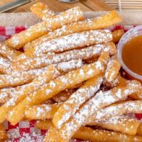 Funnel Cake Fries · Our Funnel Cake Fries covered in powdered Sugar.
