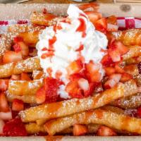 Strawberry Lovers Funnel Cake Fries · Our Funnel Cake Fries, covered in powdered sugar, topped with fresh cut strawberries, strawb...