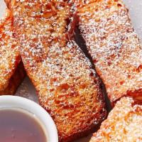 French Toast Sticks · Five French Toast Sticks, dusted with cinnamon and powdered sugar, served with syrup.